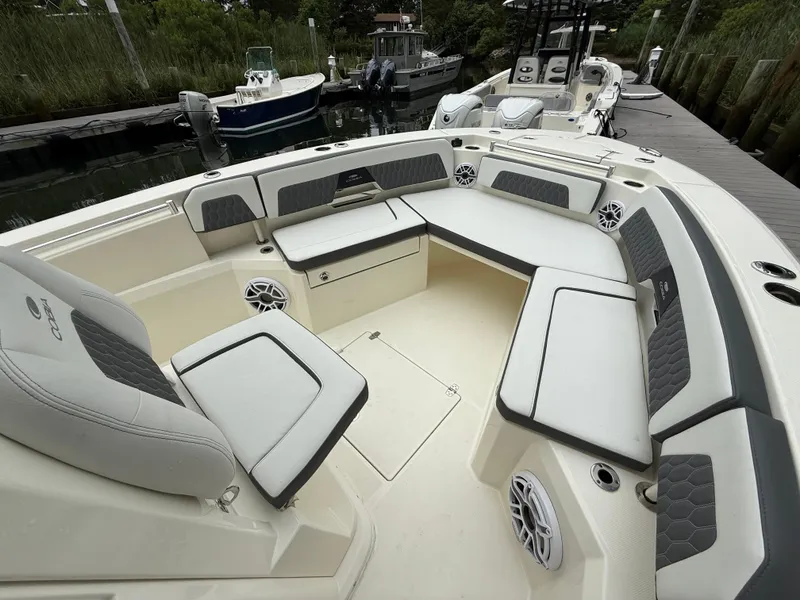 Slide: The Image of 2025 Cobia 265 Open Center Console boat with spacious seating and modern design. - 16