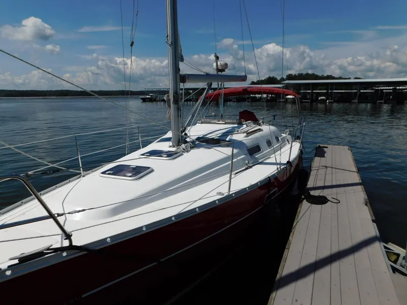 Slide: The Image of 2005 Beneteau Oceanis Clipper 323 sailboat docked on a sunny day. - 19