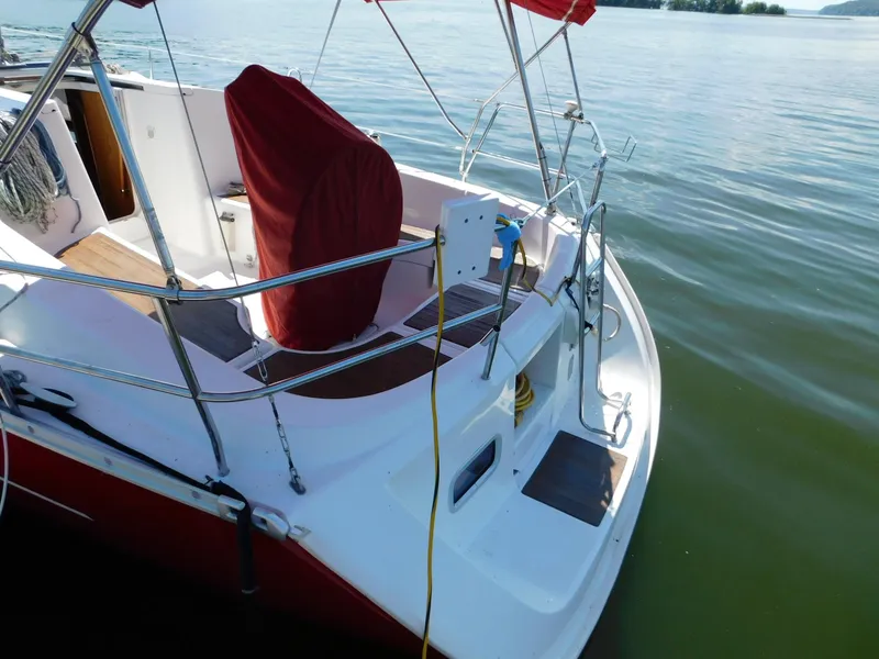 Slide: The Image of 2005 Beneteau Oceanis Clipper 323 sailboat stern view on calm water. - 24