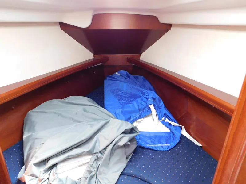 Slide: The Image of Cozy cabin interior of 2005 Beneteau Oceanis Clipper 323 sailboat with wooden finish. - 33