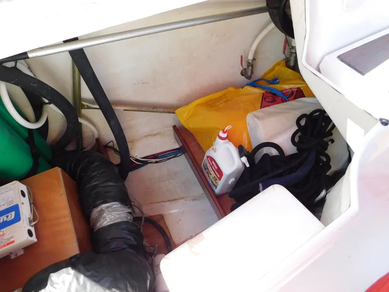Slide: The Image of Storage compartment of a 2005 Beneteau Oceanis Clipper 323 with ropes and maintenance supplies. - 39