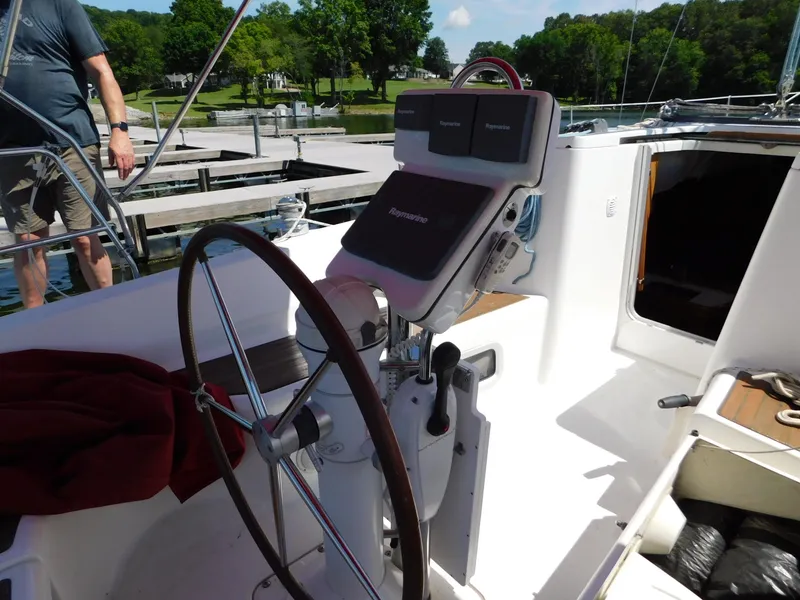 Slide: The Image of Cockpit of 2005 Beneteau Oceanis Clipper 323 sailboat with steering wheel and navigation equipment. - 41