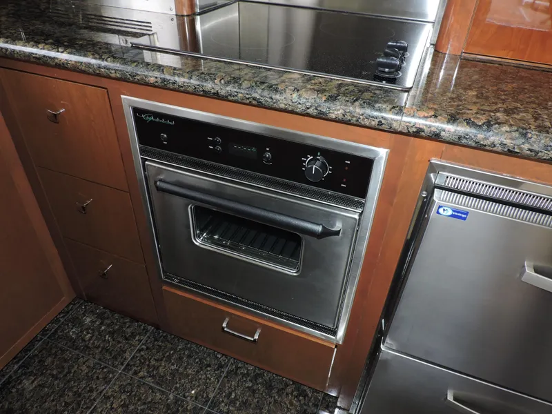 Slide: The Image of Modern kitchen in 2010 Carver 56 Voyager SE yacht with stainless steel appliances. - 15
