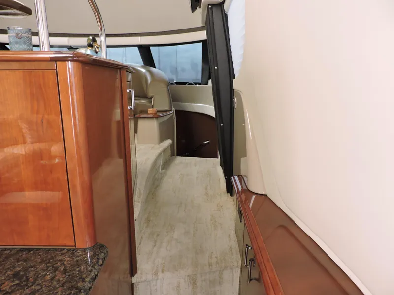 Slide: The Image of Interior of 2010 Carver 56 Voyager SE yacht with elegant wood finishes. - 19