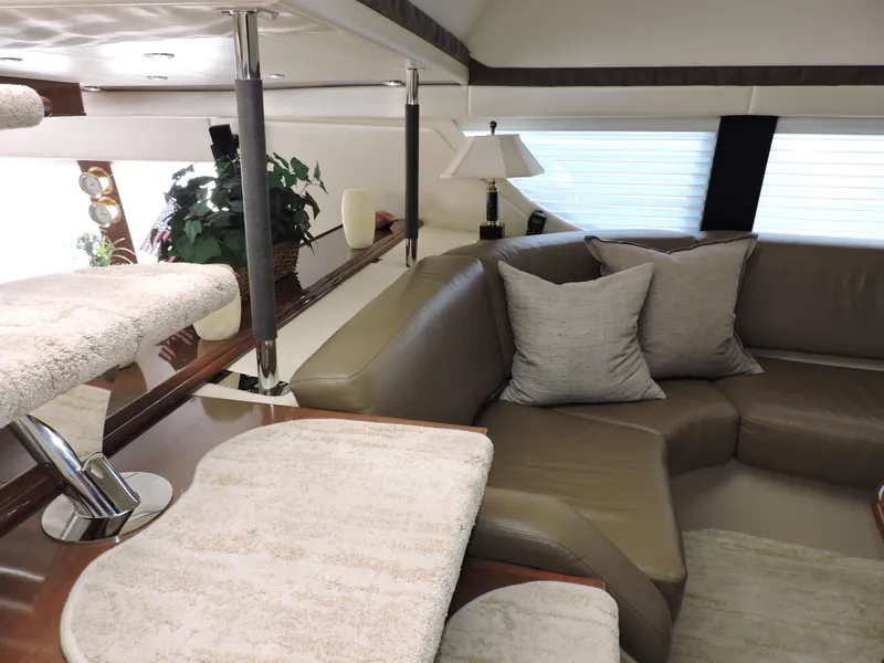 Slide: The Image of Luxurious interior of 2010 Carver 56 Voyager SE yacht with plush seating and elegant decor. - 24