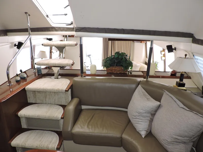 Slide: The Image of Luxurious interior of 2010 Carver 56 Voyager SE yacht with plush seating and elegant decor. - 29