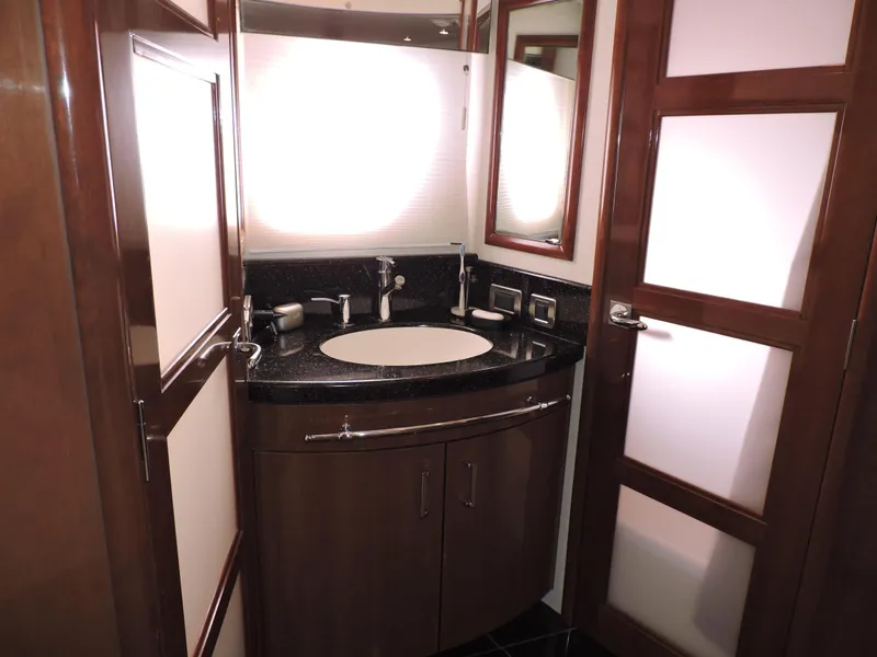 Slide: The Image of Luxurious bathroom in 2010 Carver 56 Voyager SE yacht with modern fixtures and elegant design. - 37