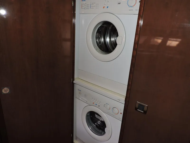Slide: The Image of Stacked washer and dryer in 2010 Carver 56 Voyager SE yacht interior. - 38
