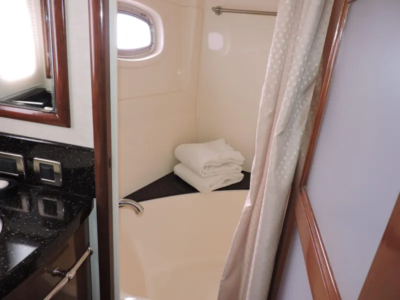 Slide: The Image of Luxurious bathroom in 2010 Carver 56 Voyager SE yacht with elegant fixtures and towels. - 40