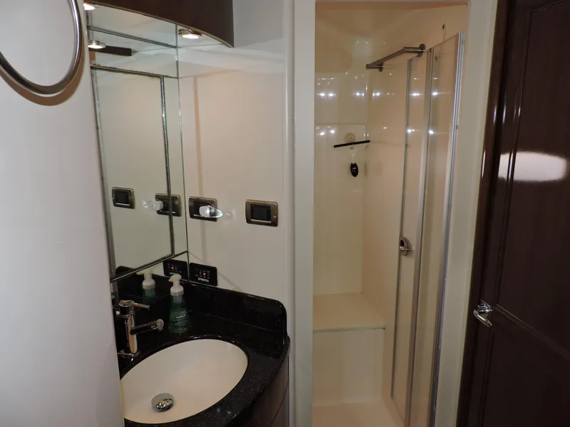 Slide: The Image of Bathroom interior of 2010 Carver 56 Voyager SE yacht, featuring sink and shower. - 47