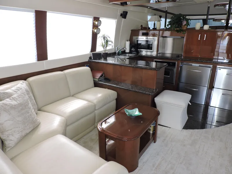 Slide: The Image of Luxurious interior of 2010 Carver 56 Voyager SE yacht with modern kitchen and seating area. - 7