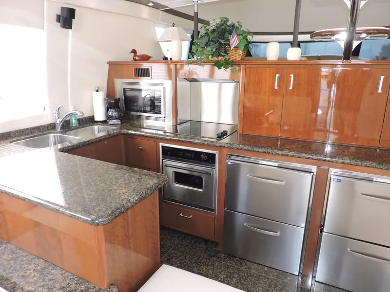 Slide: The Image of Luxurious kitchen interior of 2010 Carver 56 Voyager SE yacht with modern appliances. - 13