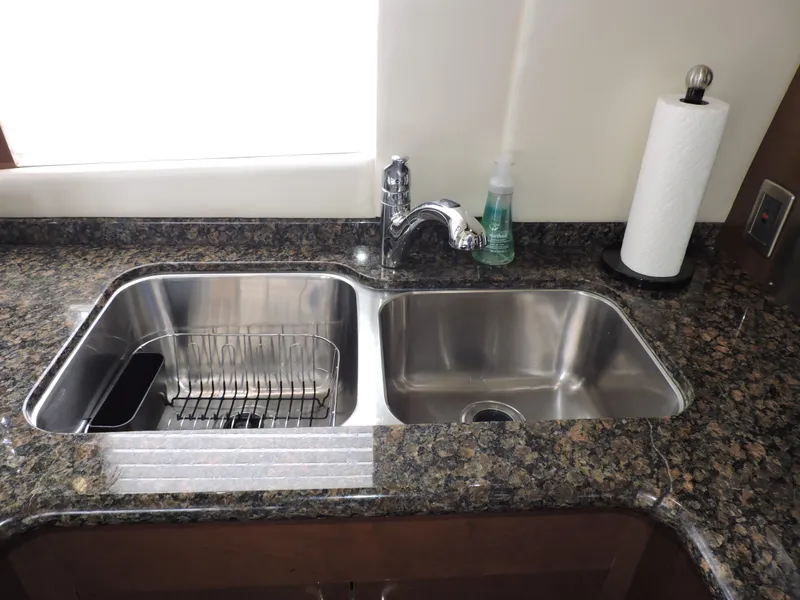 Slide: The Image of Stainless steel double sink with granite countertop in 2010 Carver 56 Voyager SE. - 18