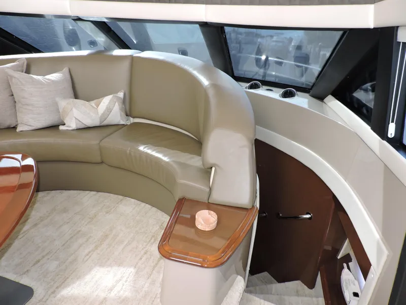 Slide: The Image of Luxurious interior of 2010 Carver 56 Voyager SE yacht with curved seating and elegant decor. - 25