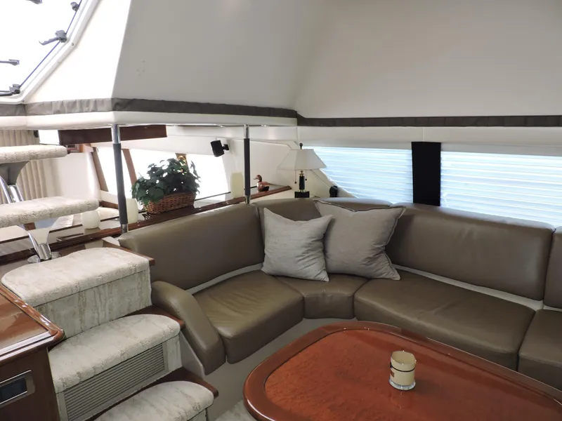Slide: The Image of Luxurious interior of 2010 Carver 56 Voyager SE yacht with plush seating and elegant decor. - 27
