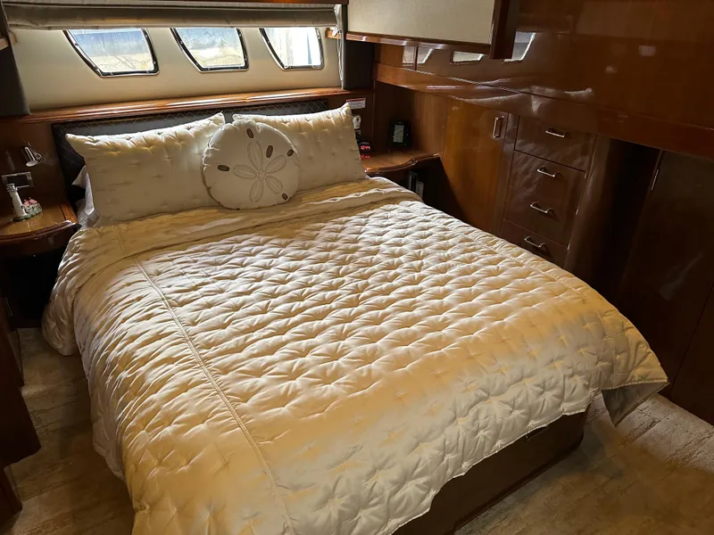Slide: The Image of Luxurious bedroom interior of 2010 Carver 56 Voyager SE yacht with elegant bedding. - 35