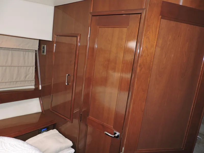 Slide: The Image of Interior of 2010 Carver 56 Voyager SE yacht with wooden cabinetry and modern design. - 44