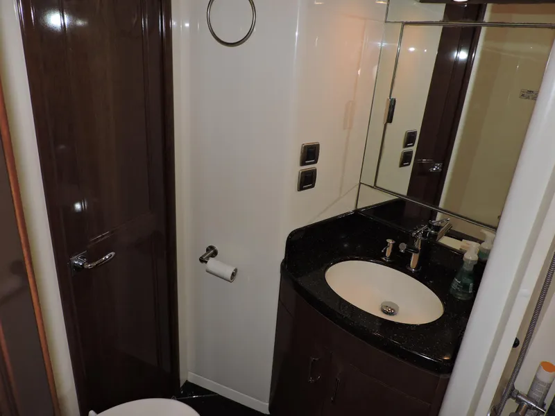 Slide: The Image of Bathroom interior of 2010 Carver 56 Voyager SE yacht, featuring sleek design and modern amenities. - 46
