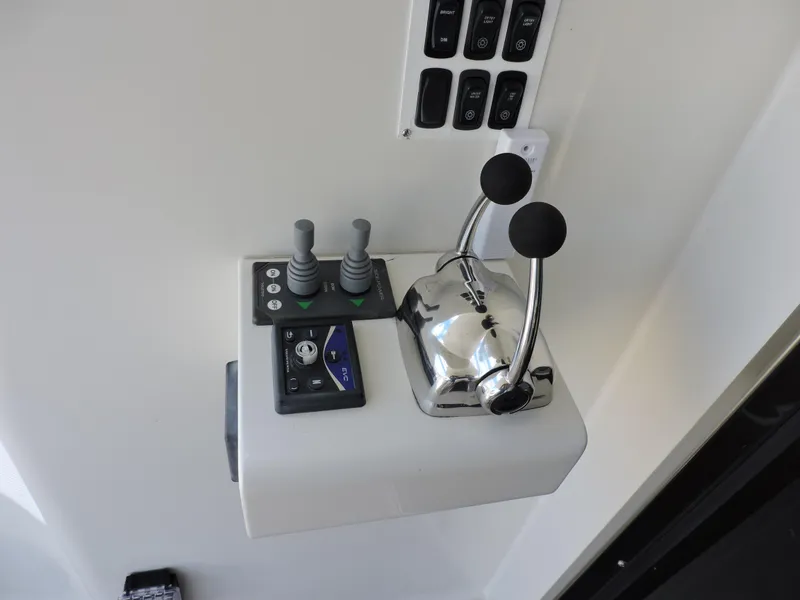 Slide: The Image of Control panel of 2010 Carver 56 Voyager SE yacht with levers and switches. - 5