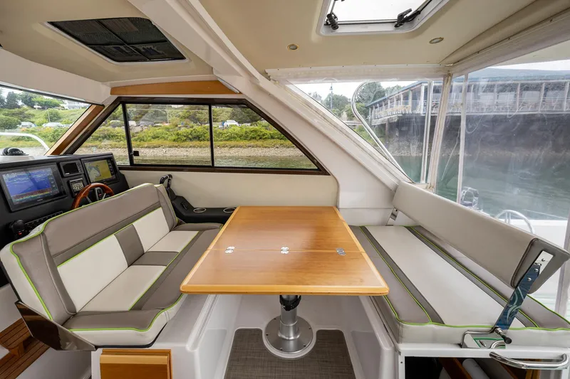 Slide: The Image of Interior of 2017 Cutwater C-302 Sport Coupe with seating and table. - 15