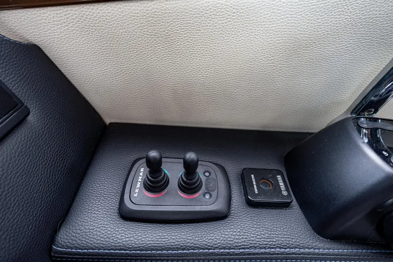 Slide: The Image of Control panel of 2017 Cutwater C-302 Sport Coupe with Lewmar joysticks and Yamaha start button. - 25