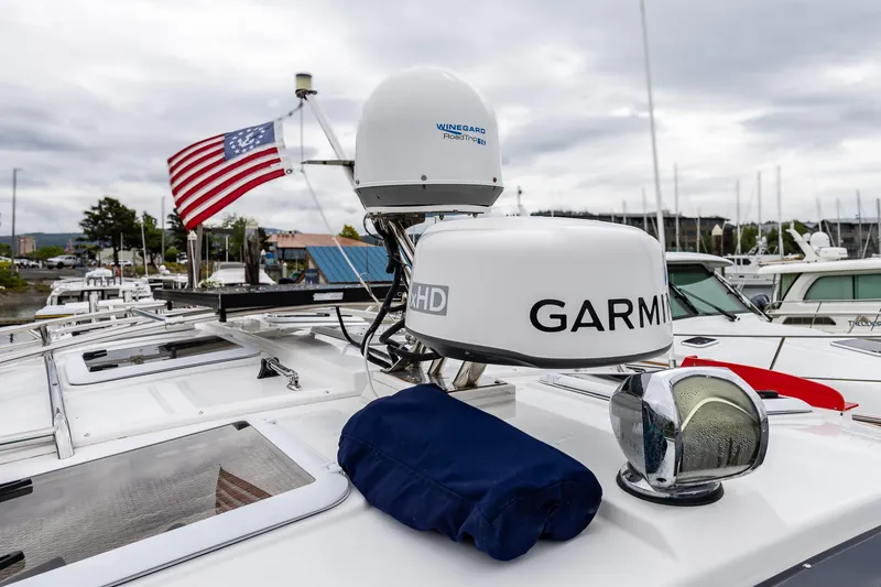 Slide: The Image of 2017 Cutwater C-302 Sport Coupe with Garmin radar and American flag on deck. - 33