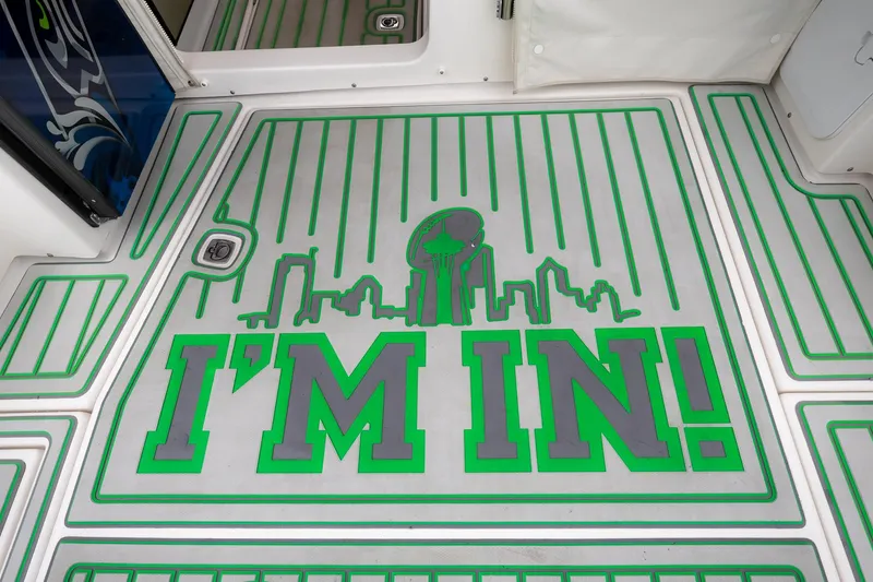 Slide: The Image of Cutwater C-302 Sport Coupe 2017 boat deck with 'I'm In!' graphic and city skyline. - 34