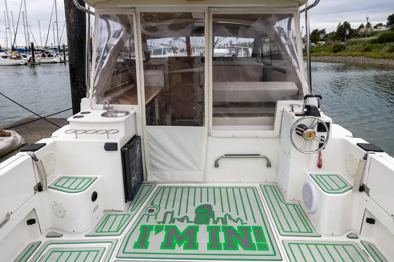 Slide: The Image of 2017 Cutwater C-302 Sport Coupe boat interior with "I'm In!" floor design at marina. - 6