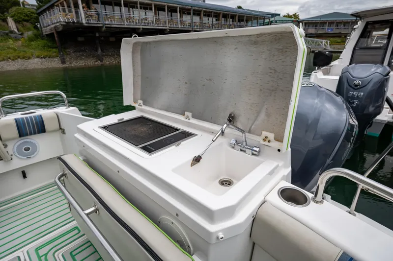 Slide: The Image of Outdoor kitchen on 2017 Cutwater C-302 Sport Coupe boat with grill and sink. - 9