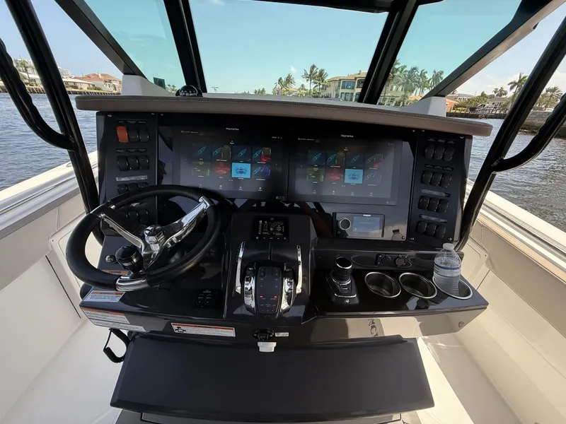 Slide: The Image of 2020 Blackfin 332 CC helm with advanced navigation displays and controls. - 11