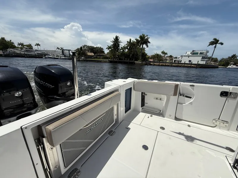 Slide: The Image of 2020 Blackfin 332 CC boat with dual Mercury engines on a sunny day. - 15
