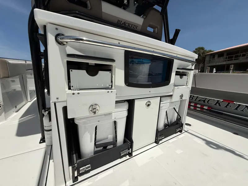 Slide: The Image of 2020 Blackfin 332 CC boat interior with storage compartments and equipment. - 17
