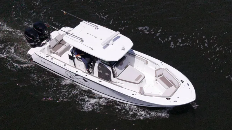Slide: The Image of 2020 Blackfin 332 CC boat cruising on water, aerial view. - 5