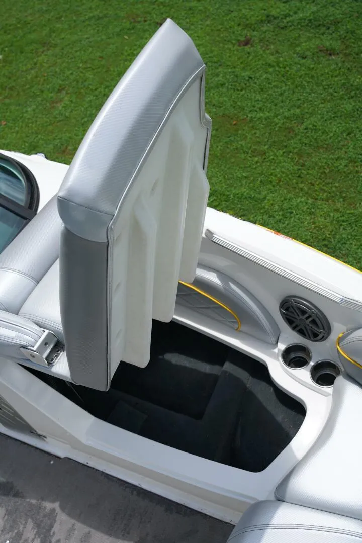 Slide: The Image of 2014 MasterCraft X-25 boat interior with gray seating and speaker detail. - 27