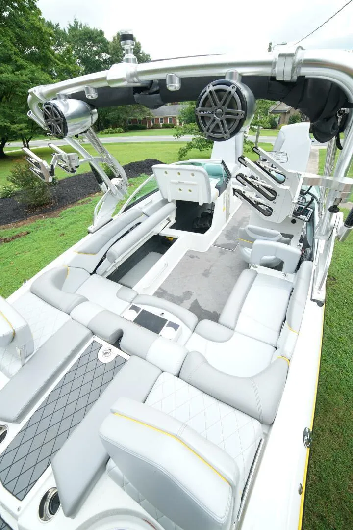 Slide: The Image of 2014 MasterCraft X-25 boat interior with plush seating and advanced audio system. - 36