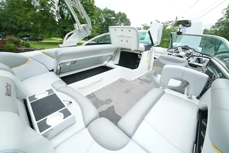 Slide: The Image of 2014 MasterCraft X-25 boat interior with sleek seating and modern dashboard. - 37