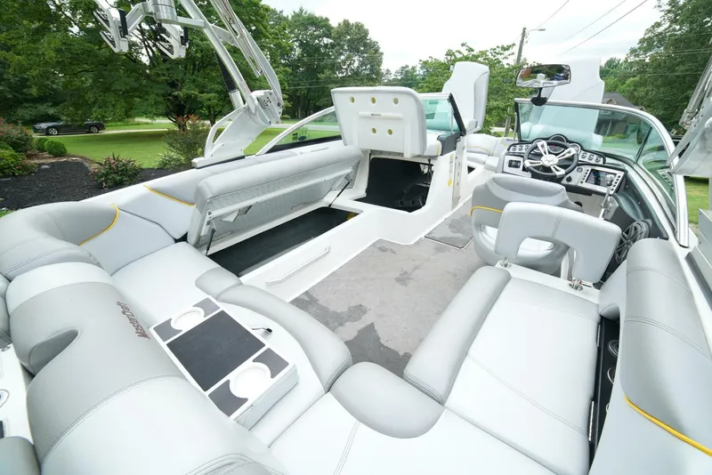 Slide: The Image of 2014 MasterCraft X-25 boat interior with luxurious seating and modern dashboard. - 38