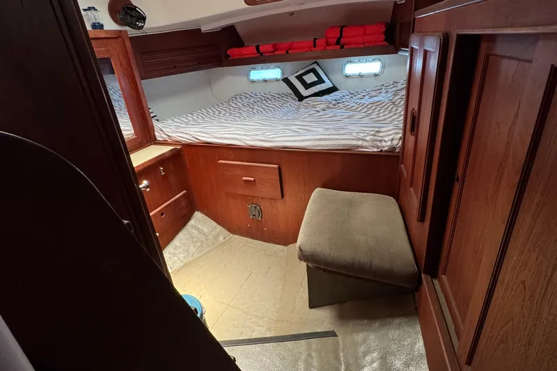 Slide: The Image of Cozy cabin interior of 1981 Morgan 416 Out Island sailboat with bed and wooden cabinetry. - 27
