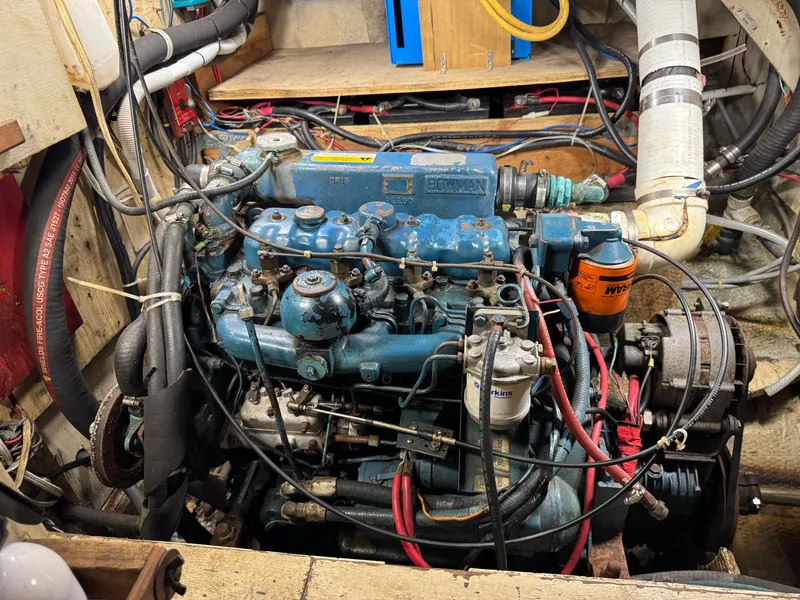 Slide: The Image of Engine of a 1981 Morgan 416 Out Island sailboat, featuring intricate wiring and components. - 35