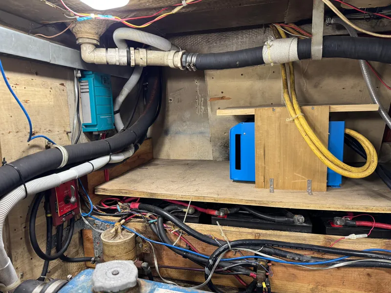 Slide: The Image of Engine room of 1981 Morgan 416 Out Island sailboat with wiring and equipment. - 36