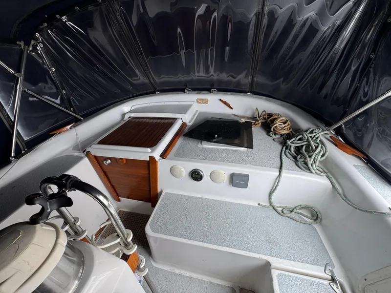 Slide: The Image of Interior view of 1981 Morgan 416 Out Island sailboat cockpit with ropes and equipment. - 4