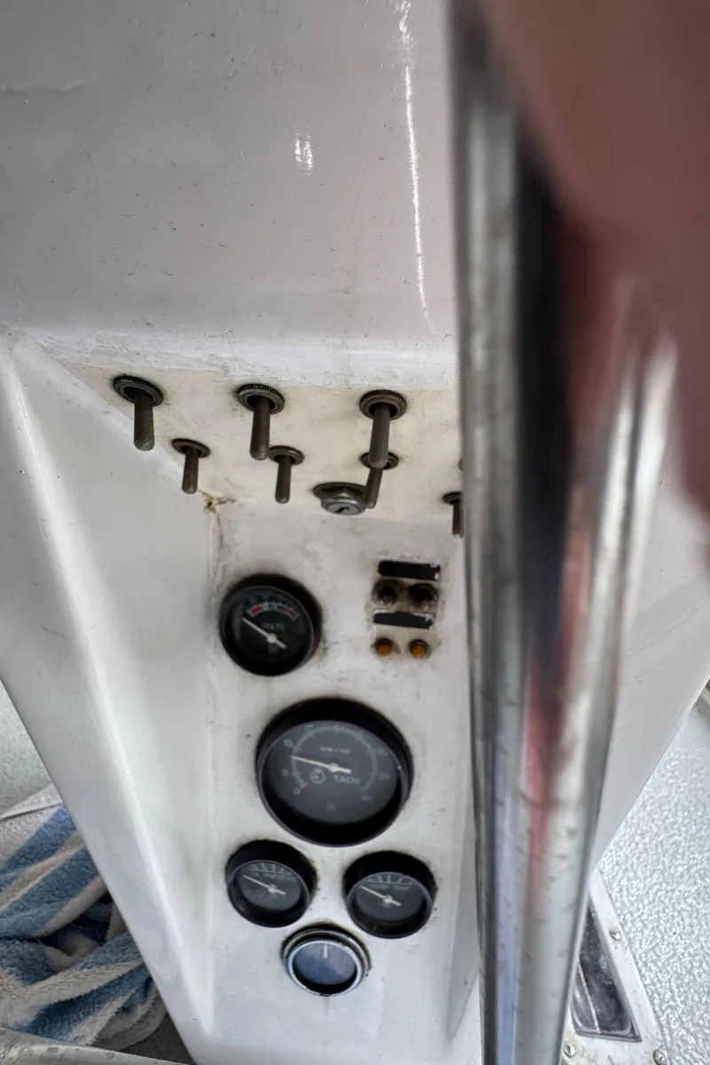 Slide: The Image of Control panel of a 1981 Morgan 416 Out Island sailboat with gauges and switches. - 41