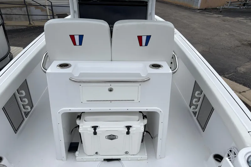 Slide: The Image of 2025 Wellcraft 243 Fisherman boat interior with storage and seating area. - 15