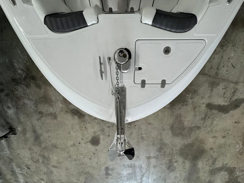 Slide: The Image of 2025 Wellcraft 243 Fisherman boat bow with anchor and seating, viewed from above. - 2