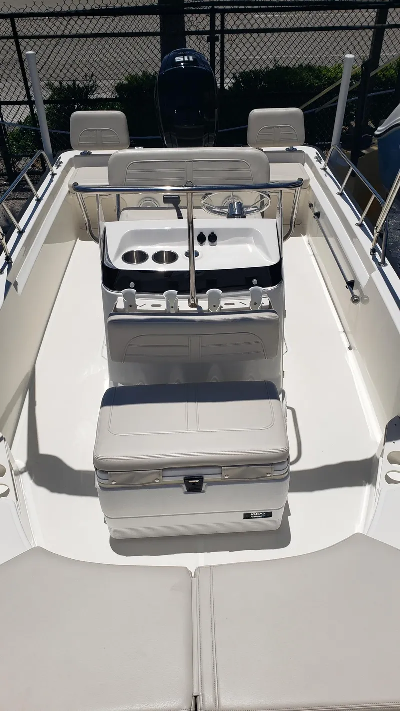 Slide: The Image of 2022 Boston Whaler 170 Montauk boat interior with seating and console. - 26