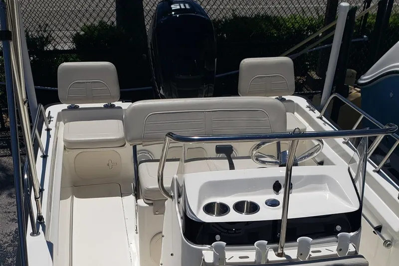 Slide: The Image of 2022 Boston Whaler 170 Montauk boat interior with seating and steering console. - 30