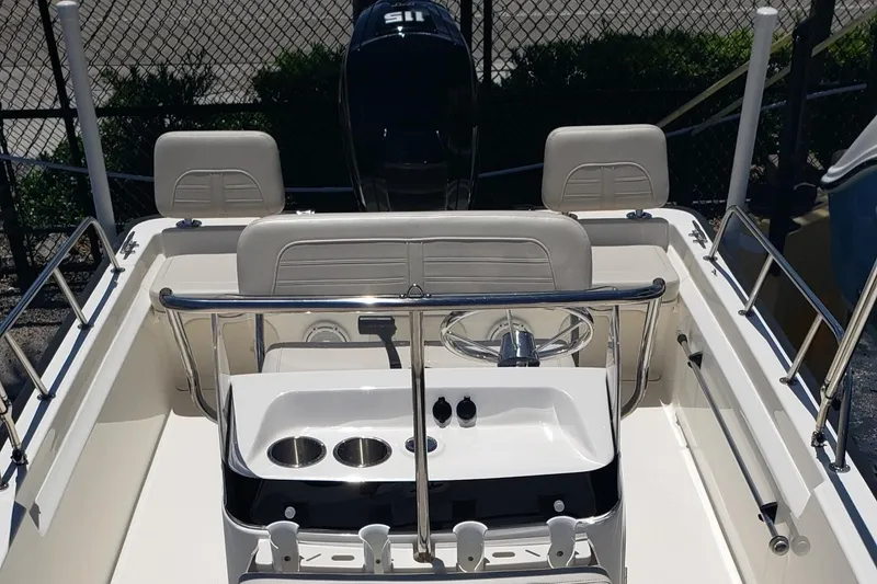 Slide: The Image of 2022 Boston Whaler 170 Montauk boat interior with steering wheel and seating. - 32