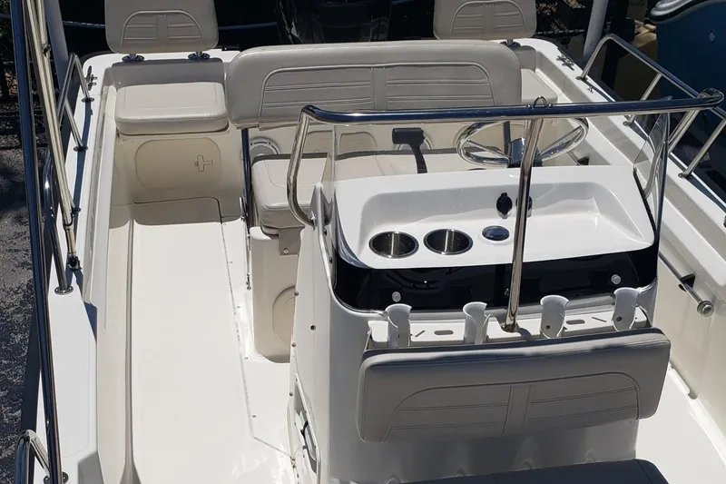 Slide: The Image of 2022 Boston Whaler 170 Montauk boat interior with seating and steering console. - 35