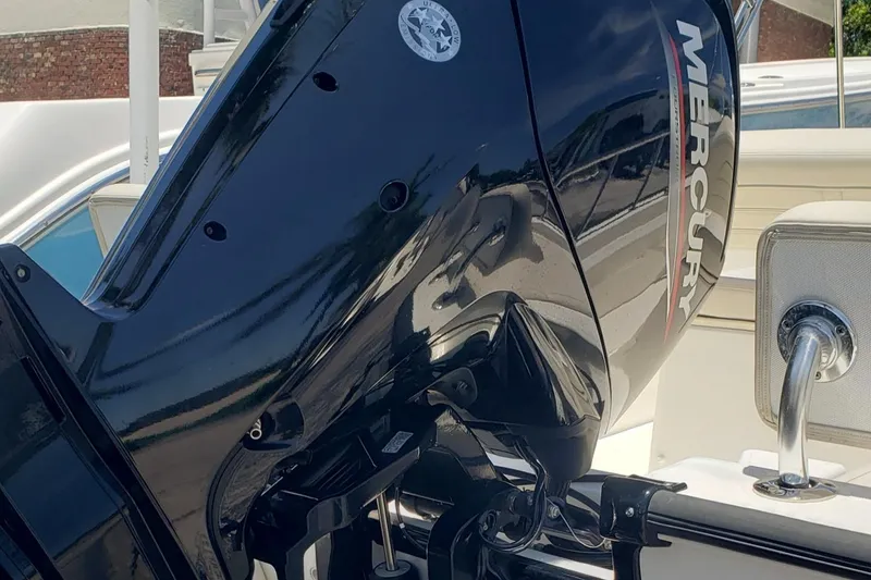 Slide: The Image of 2022 Boston Whaler 170 Montauk with Mercury outboard motor, close-up view. - 44