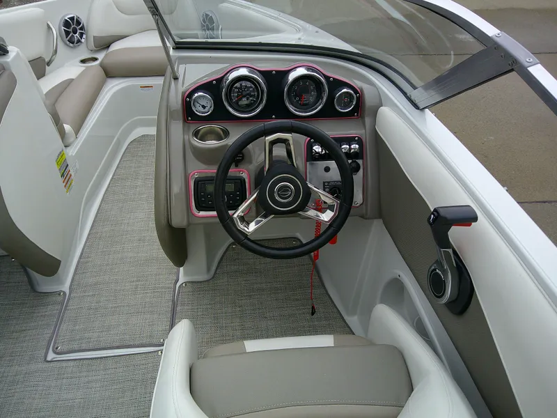 Slide: The Image of 2019 Crownline 19 XS boat interior with beige and white seating arrangement. - 9